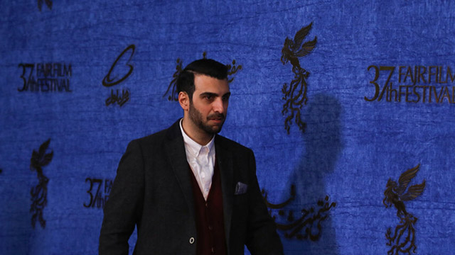 Poulad Kimiaee attends the first day of the 37th Fajr film festival.
