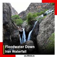 Floodwater flows down Iran waterfall