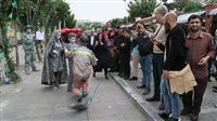 Silver men pose for camera in Iran