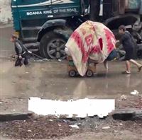 Gazan children's exodus under rain